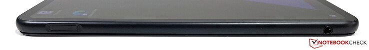 Vänster sida: Strömknapp med fingeravtrycksläsare, 3,5 mm stereojack