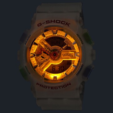 Casio G-Shock Pokémon GA-110 med sin bärnstensfärgade LED-bakgrundsbelysning tänd i en mörk miljö.
