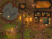Skärmbild från RimWorld som visar en koloni under attack, med bränder, djur och byggnader.