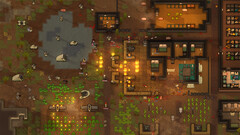 Skärmbild från RimWorld som visar en koloni under attack, med bränder, djur och byggnader.