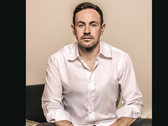 En porträttbild av GameStops VD Ryan Cohen
