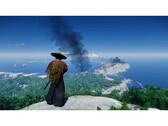 En landskapsbild från Ghost of Tsushima visar Jin som står på ett berg med utsikt över ön. (Bildkälla: Steam)