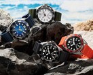 Fyra Citizen Promaster Marine-dykarklockor i färgvarianterna vitt, svart, blått och orange, utställda på stenar vid havet.