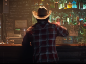 En skärmdump av Wolverine i flanell och cowboyhatt från Marvels Wolverine announcement trailer (bildkälla: PlayStation YT)