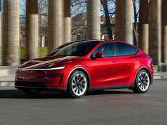 Tesla Model Y 2026 i rörelse i Ultra Red. (Bildkälla: Tesla)