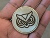 Stock SVG-design på mässingsmynt med hjälp av fiberlaser.