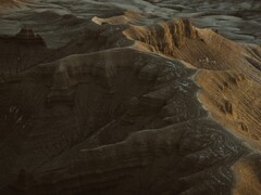 En dekorativ bild. Bilden visar en flygbild av ett berg (Bildkälla: Harrison Steen via Unsplash; beskuren)