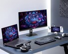 Spelskärmen Asus XG27UCMG tillsammans med olika elektroniska produkter från Asus