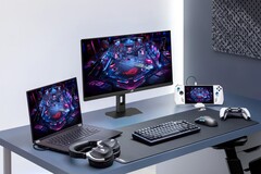 Spelskärmen Asus XG27UCMG tillsammans med olika elektroniska produkter från Asus
