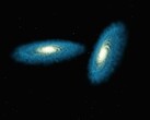 En konstnärs illustration som visar två galaxer.