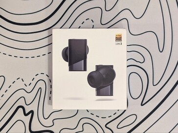 Detaljhandelsförpackning för de trådlösa öronsnäckorna Status Pro X.