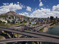 En skärmdump från City Masterplan som visar komplexa vägnät med skyskrapor och byggnader i bakgrunden