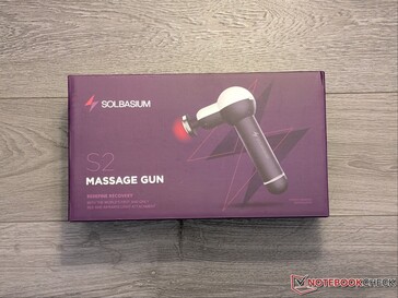 S2 massagepistol i detaljhandelsförpackning.